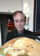 Dean Sena holding the World